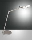 Moderne LED-Schreibtischlampe aus Metall mit rundem Leuchtkopf auf grauem Hintergrund, energiesparend.