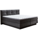 Modernes Boxspringbett mit gepolstertem Kopfteil und weißer Matratze, ideal für Schlafzimmer und Schlafkomfort.