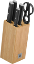 Messerblock aus Holz mit vier Küchenmessern und einer Küchenschere, WMF-Logo, modernes Küchenzubehör.