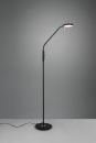 Moderne schwarze Stehlampe mit flexiblem Arm und rundem Lampenschirm, leuchtet auf grauem Hintergrund.