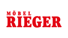 rotes Logo mit dem Schriftzug „MÖBEL RIEGER“ auf transparentem Hintergrund, serifenbetonte Schrift.