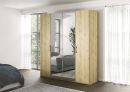 Moderner Kleiderschrank aus Holz mit Spiegeltüren, vier Türen, Metallgriffen und natürlicher Eichenoptik.