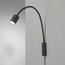 Schwarze LED-Wandleuchte mit flexiblem Arm, modernes Design, Leselampe an grauer Wand montiert.