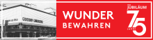 Historisches Schwarz-Weiss-Foto eines Rieger-Gebäudes, daneben roter Banner mit „Wunder bewahren“ und Jubiläumslogo „75 Jahre“.  
