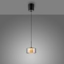 Moderne Pendelleuchte mit schwarzem Kabel und Glas-Lampenschirm, leuchtet warm an grauer Decke.