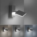 Moderne LED-Wandleuchte aus Edelstahl, leuchtet an Wand, verschiedene Lichtfarben, minimalistisches Design.