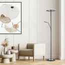 Moderne Stehlampe mit Leselicht neben beigem Sessel und abstraktem Wandbild in stilvollem Wohnzimmer.